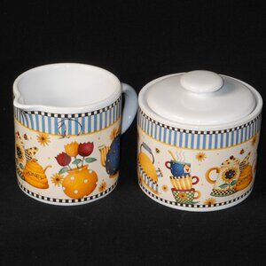 colorful sugar bowl & creamer set. Sakura TEAPOTS 1998 Debbie MUMM stoneware